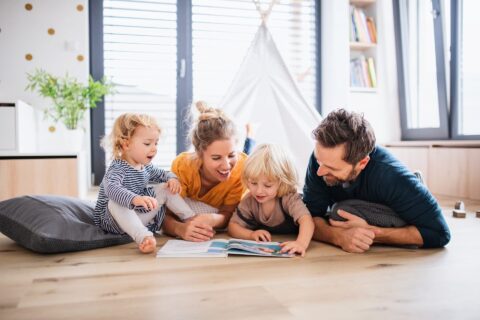 A happy family playing on the floor